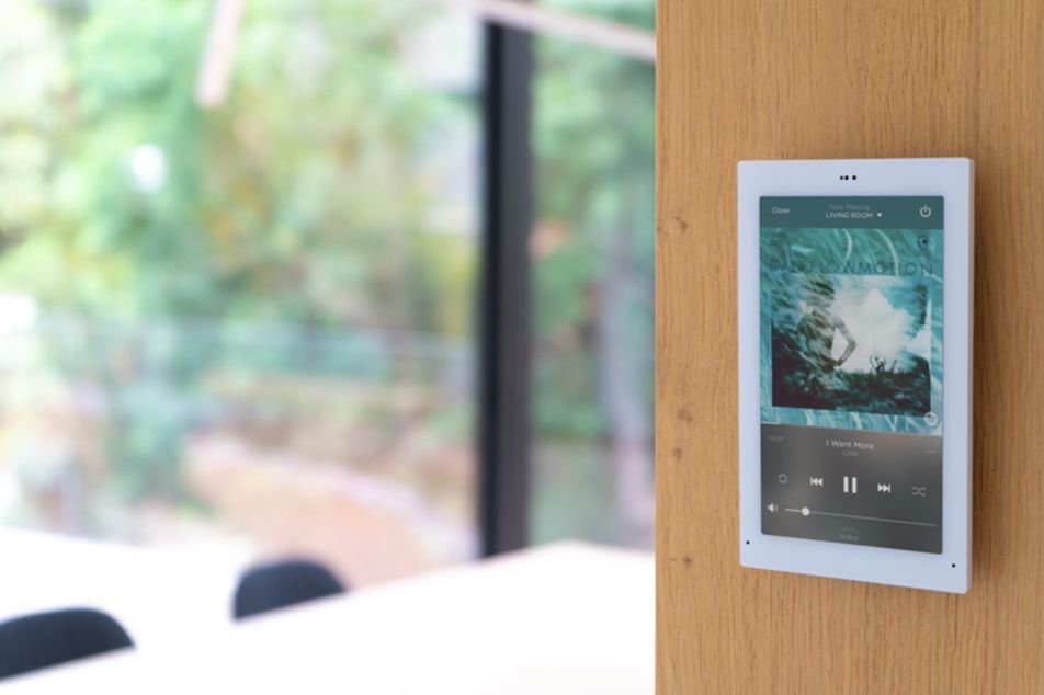 Savant touch panel mounted flush to the wall for convenience