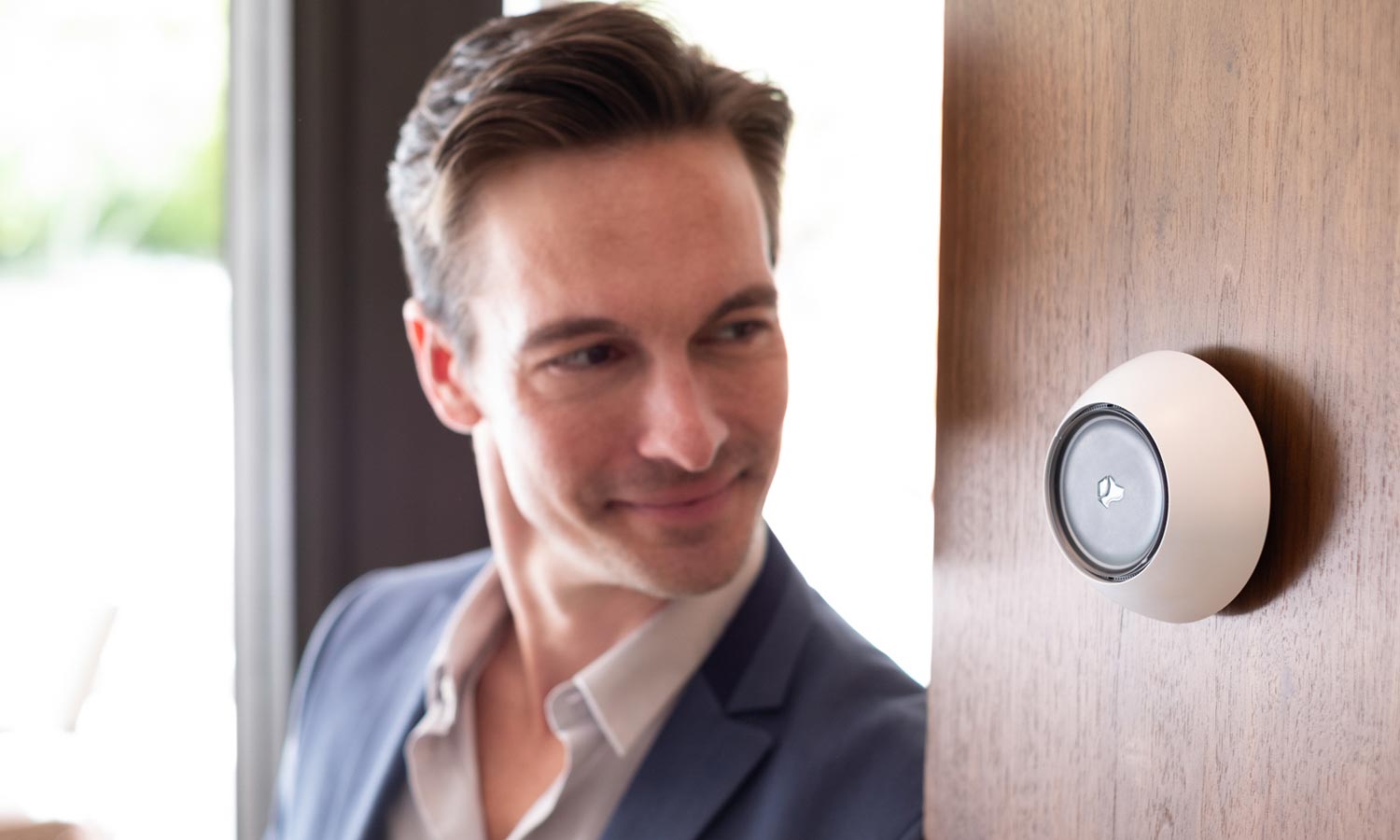 Josh.ai voice control device mounted on a wall, offering advanced home automation capabilities.