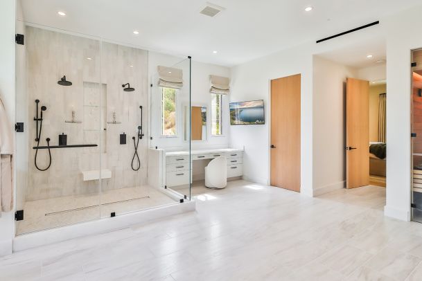 Primary bathroom TV and swivel mount