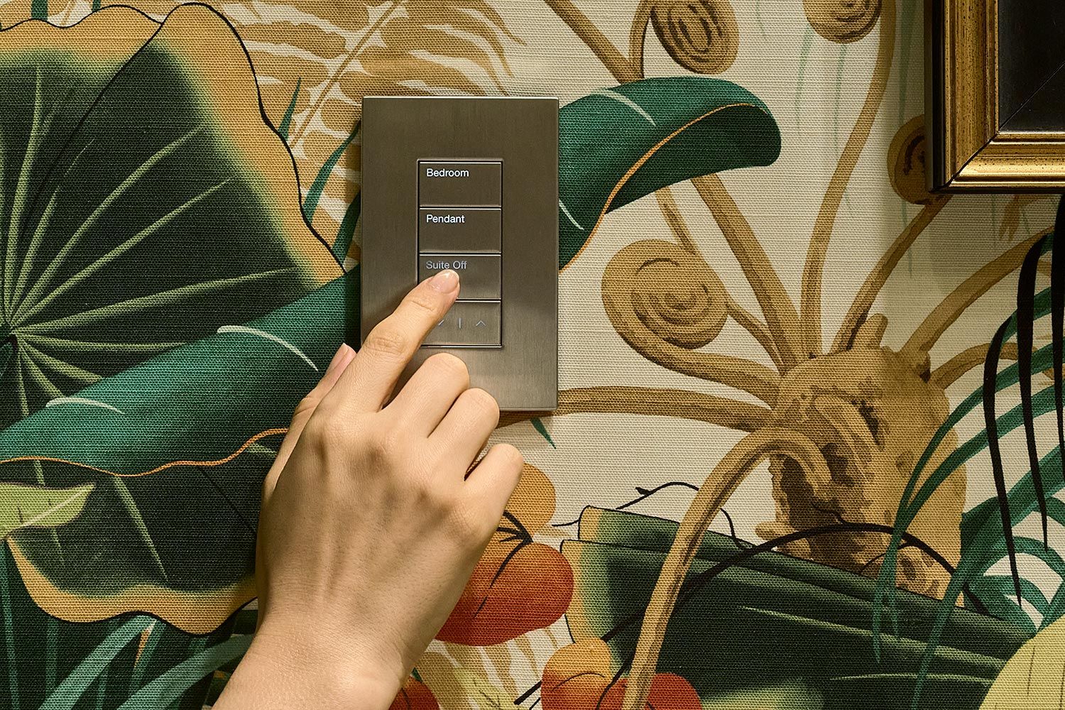 Woman's hand pressing a Palladiom keypad