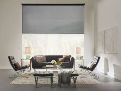 Living space with motorized window treatment through smart home automation.
