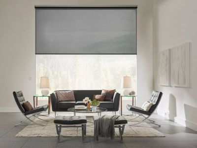 Living space with motorized window treatment through smart home automation.