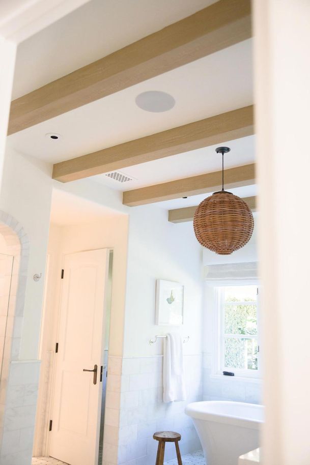 Modern bathroom in white and wood colors with in-ceiling Speakers in Camarillo