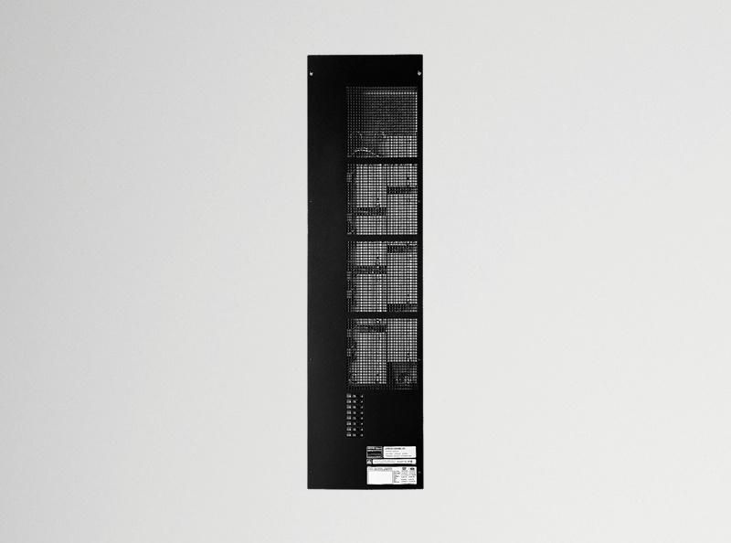 Tall, narrow, black Lutron dimming panel with multiple modules and ventilation slots.