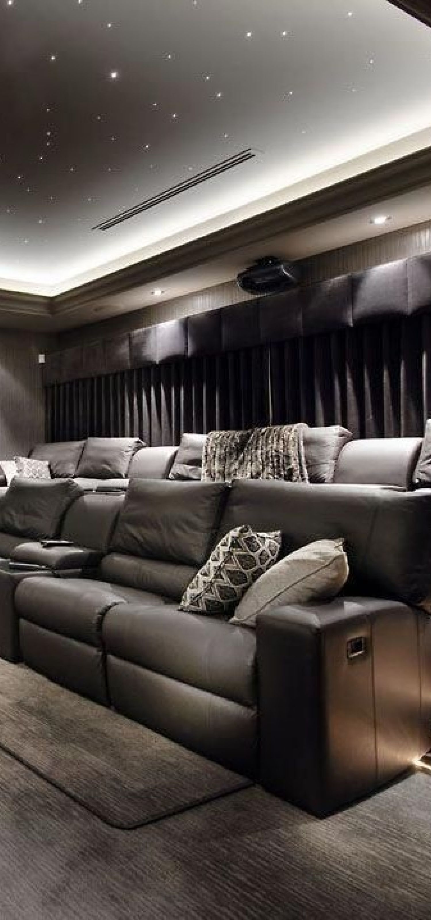Custom theater seating in a dedicated theater room
