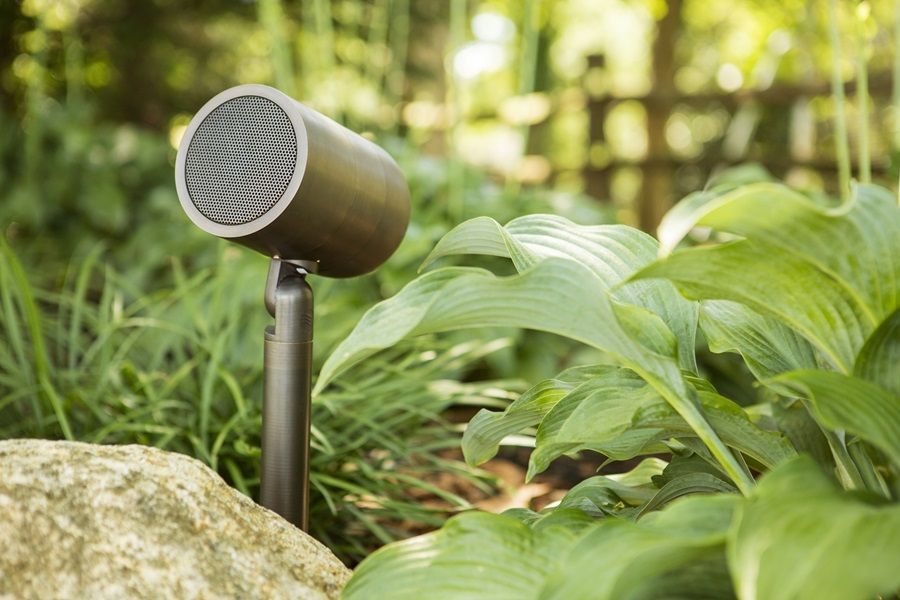 Outdoor landscape speakers carefully placed in a planter area