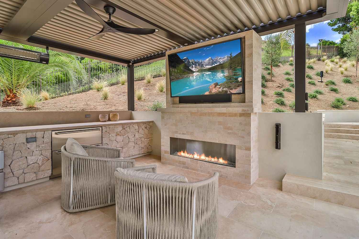 Backyard lounge area with TV and speakers