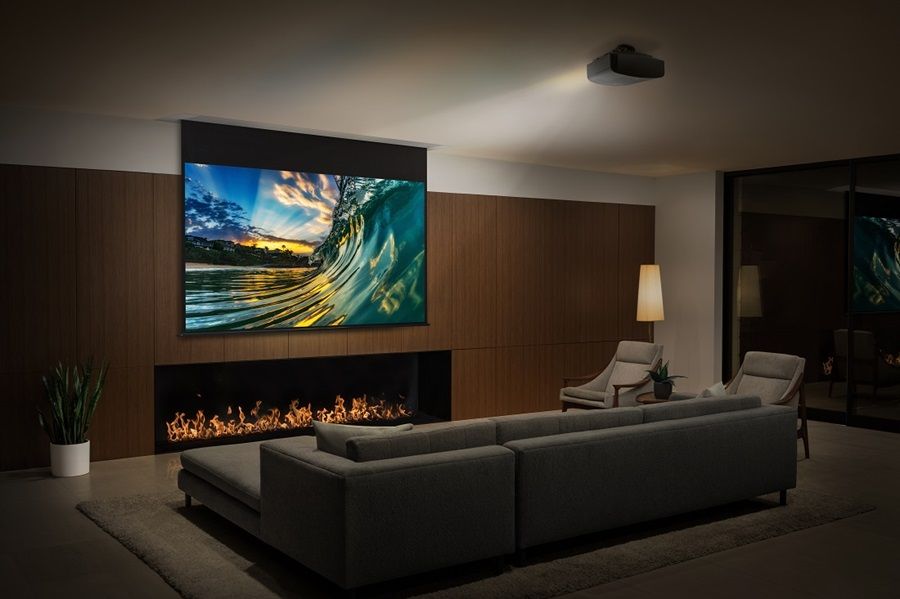 Drop down projector screen with projector in dedicated home theater room. 