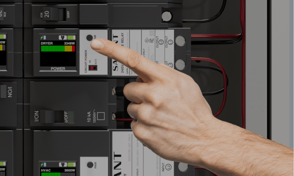 Man's hand pointing to Savant Relay Power Module